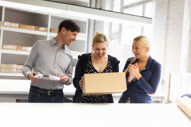 istock young adult's group looking at surprise parcel 168324181