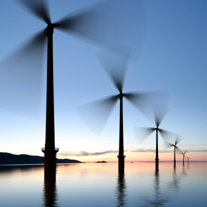 offshore wind turbines in silhouette at twilight, square frame (XXXL)