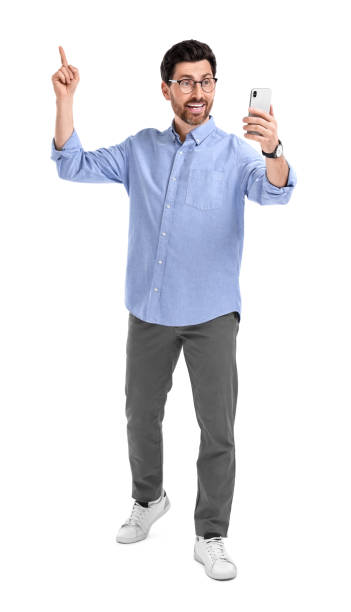 istock Smiling man taking selfie with smartphone on white background 1683245474