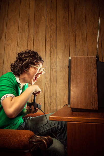 gamer nerd playing video games on t.v. - gamer video game 1980s style television stok fotoğraflar ve resimler