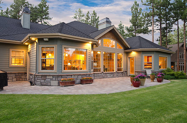 Twilight exterior of home and landscape This taken at twilight.  Home Outdoor lighting stock pictures, royalty-free photos & images