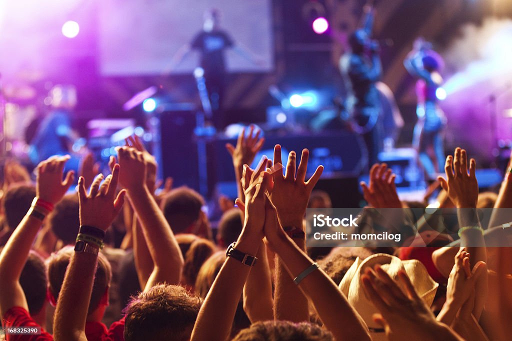 Hands up at the concert Group of people raising their hands at the concert Music Festival Stock Photo