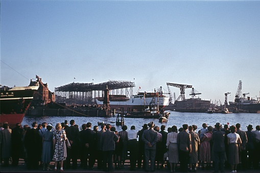 Hamburg, Germany, 1957. Hamburg residents and visitors watch a launch in the port of Hamburg.