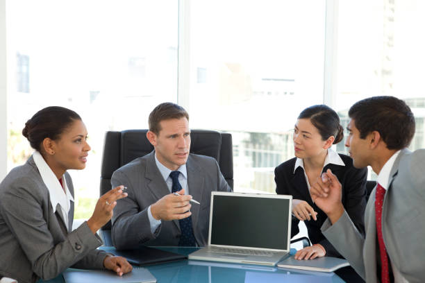 Business managers thinking together at a meeting