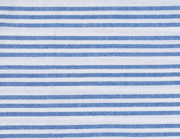 Texture of linen white towel with blue stripes