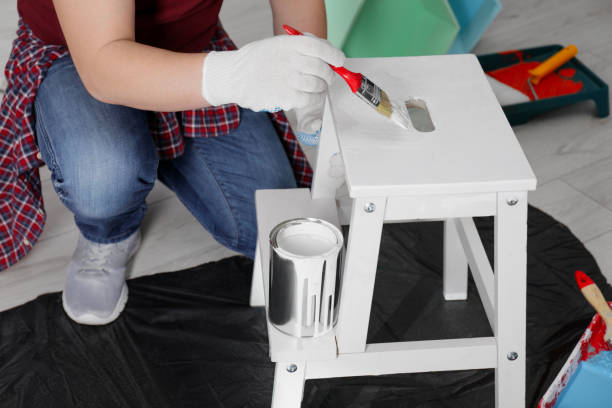 istock Man using brush to paint bekvam with white dye indoors, closeup 1683313939