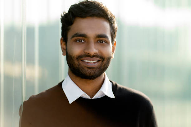 istock Smiling Indian student looking at camera standing in university campus. Education concept 1683330751
