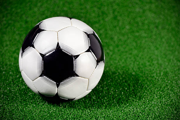 istock Football on green artificial grass 168334684