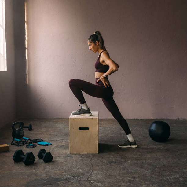 istock Beautiful Woman Exercising at the Gym 1683408621