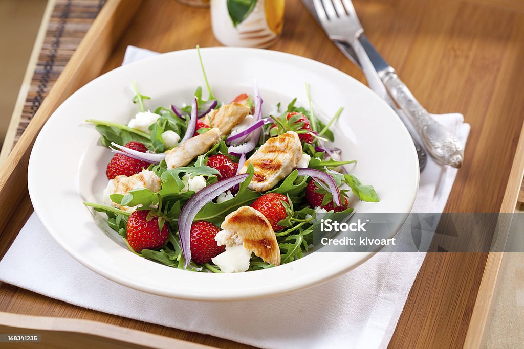 Chicken meal Grilled chicken on arugula salad with strawberries and red onion Strawberry Stock Photo