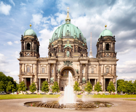 Facade of the Berlin Cathedral (Berliner Dom) with dramatic sky on a late Spring day.