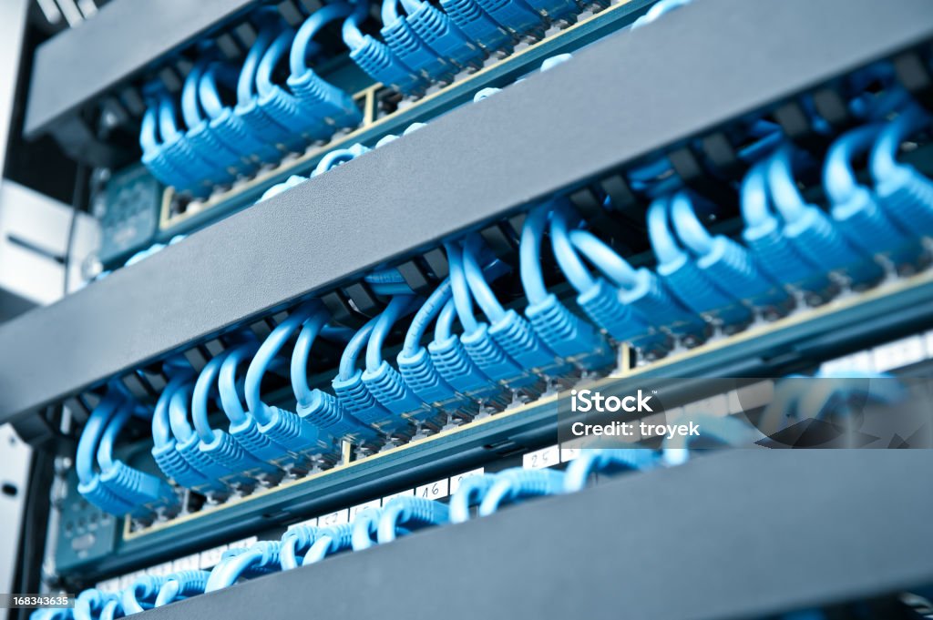 Network hub and cable Network panel, hub and cable Blue Stock Photo