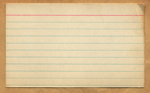 Scan of an old vintage and retro looking index card with wrinkles in the corner and signs wear and tear.  Grunge but useful for design element.    Lined card with a read heading line at the top and the other lines are blue.