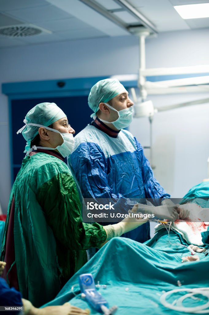 Angio Operation Cardiologists are in a angio operation, following the LCD screens for the stent...  Stent Stock Photo