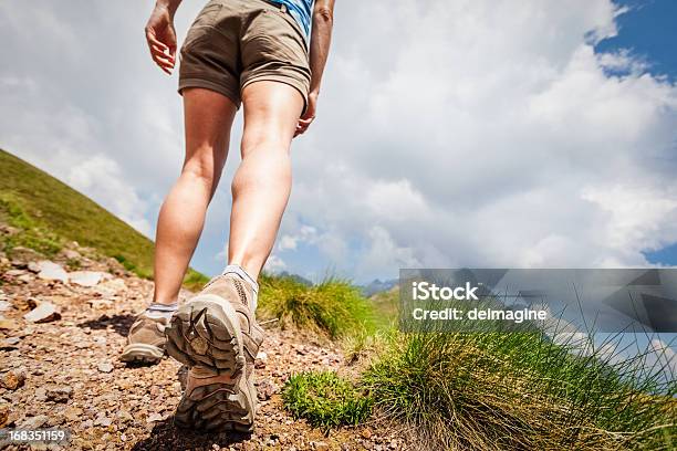 Hiker Walks On Mountain Trail Stock Photo - Download Image Now - Close-up, Hiking, Hiking Boot