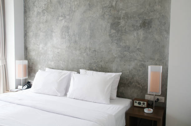 Tidy bed with bedside lamps