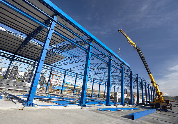 A crane working on a factory building