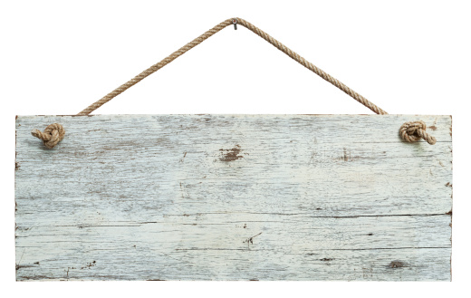 Old weathered white wood signboard, hanging by old rope from a nail, high resolution, composite image, isolated on white, clipping path included.