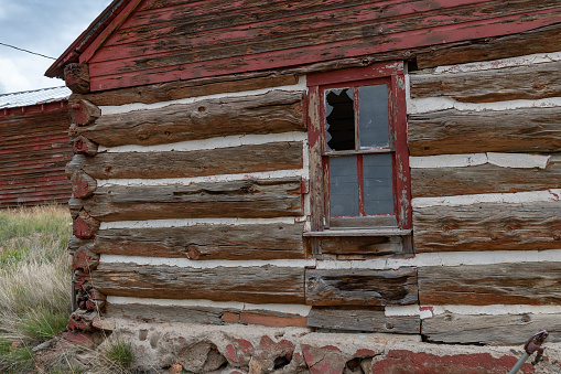 Rocky Mountain log cabin with picture window and 2 doors in central Colorado in western USA of North America. Nearest cities/towns are Colorado Springs, Denver, Fairplay, and Lake George, Colorado.
