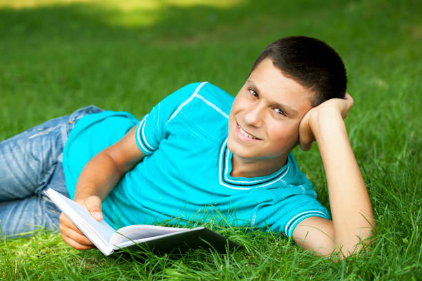 istock Teenage boy on School Campus Grass 168355186