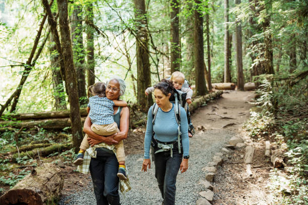 istock Multiracial multi-generation family hiking in forest 1683553128