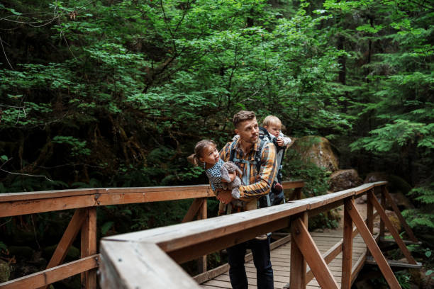 Close up of a young family hiking in a forest