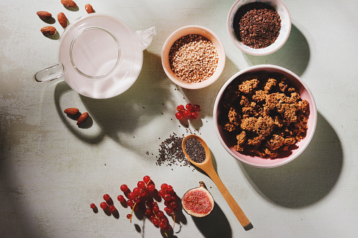 Granola with almond milk, seeds, fruits and copy space