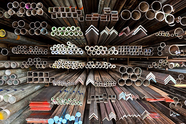 Looking for the right angle! Various angle iron profiles and steel rods kept in storage shelves in a steel shop. construction material stock pictures, royalty-free photos & images