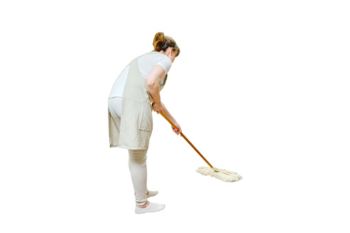 A woman in an apron cleans the floor with a mop in a home kitchen, isolated on a white background