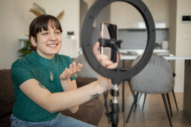 istock Smiling influencer records her podcast 1683583369