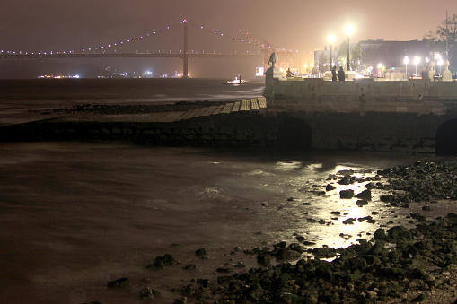 Rivershore of Tejo Lisbon by dark night  when raining