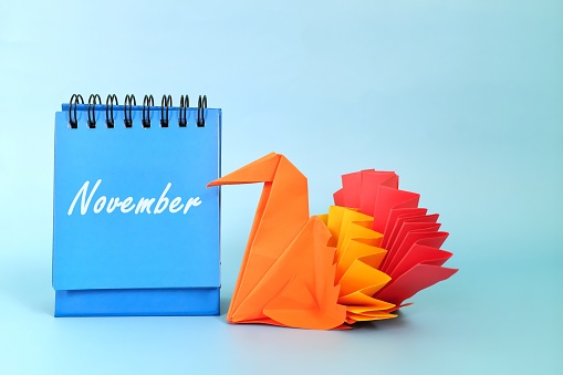 Selective focus of November calendar with turkey decoration. Thanksgiving day and Hello November concept.