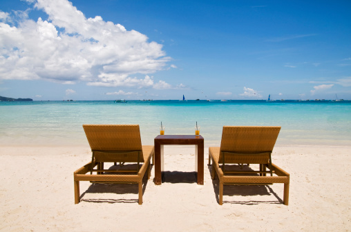Beach Chairs on White Sand 