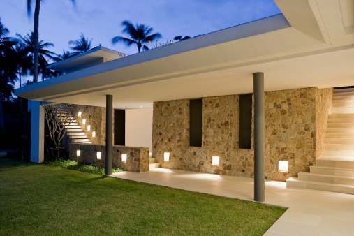 Exterior view of modern luxury house with swimming pool.