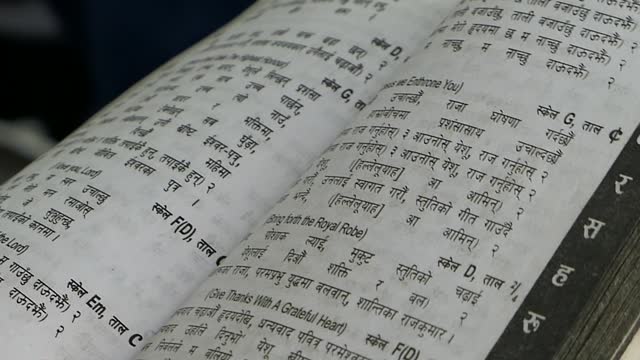 Close Up Shot of Hymn Book & Bible in Nepalis. Kathmandu Nepal