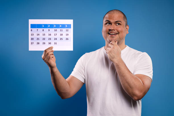 istock man holding calendar and looking to the side 1683683824
