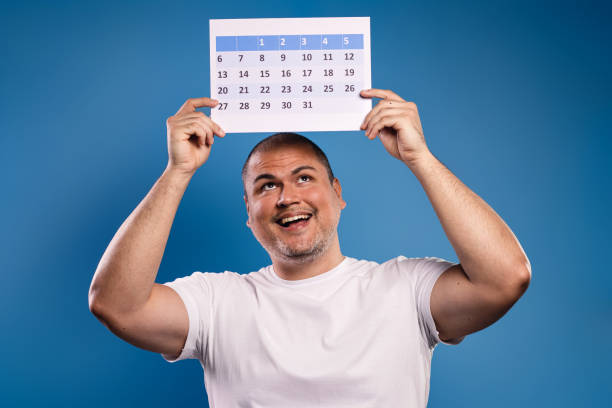 istock man holding calendar above head 1683683829