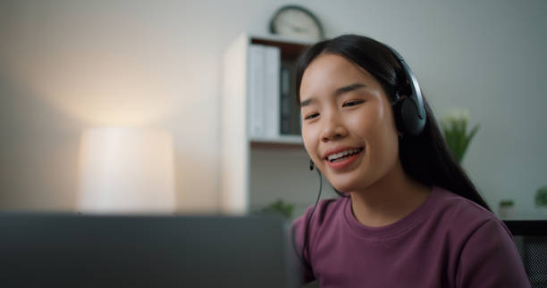 istock Asian businesswoman using computer on table to make video conference meetings 1683697945