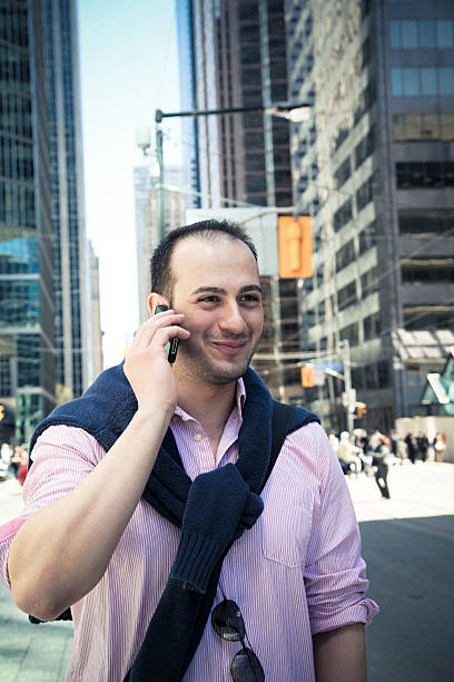 istock Young Man Outdoors on Cell Phone 168379368