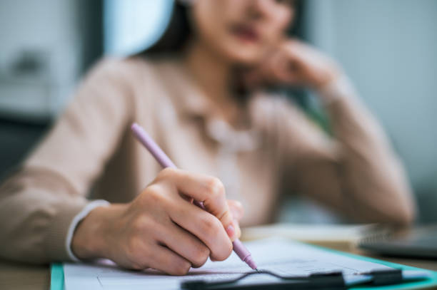 istock young working woman use pen write on clipboard during work at home 1683805283