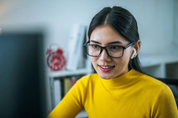 istock Young businesswoman video call through desktop computer at home 1683806330