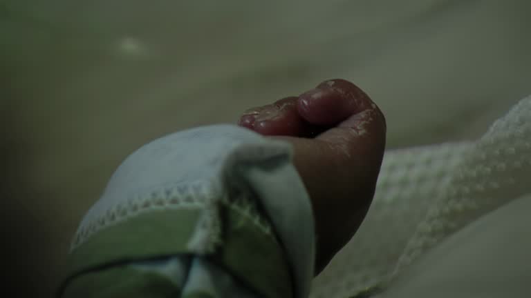 Hand of a Newborn Baby at Neonatal Intensive Care in Hospital. Close Up.