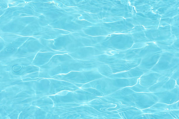 istock Defocus blurred transparent blue colored clear calm water surface texture with splashes and bubbles. Trendy abstract nature background. Water waves in sunlight with copy space. Blue watercolor shining 1683817828