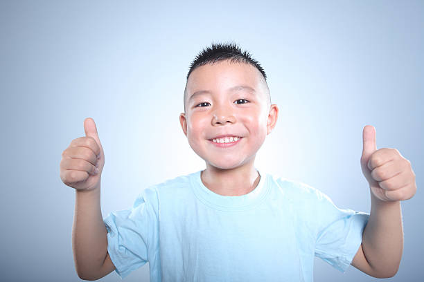 istock Thumbs up! Smiling cute boy is happy 168381902