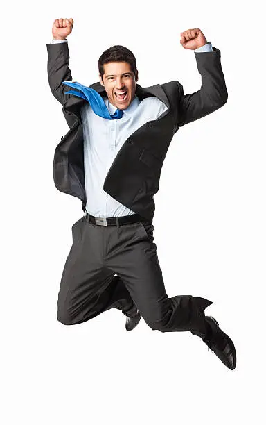 Portrait of an excited young businessman jumping in air. Vertical shot. Isolated on white.