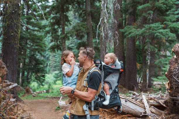 istock Young father holds children while hiking in Oregon 1683860214