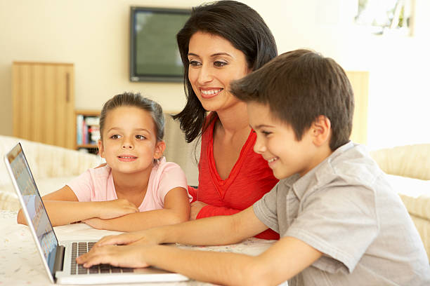 istock Hispanic Mother And Children Using Computer At Home 168389162