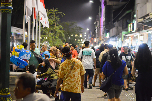 Malioboro Yogyakarta, Indonesia - June 6, 2019: Nighttime atmosphere on the streets of Malioboro which are busy with visitors