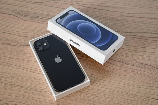 Toronto, Canada - September 15, 2023:  A brand new black Apple iPhone 12 in its original box.