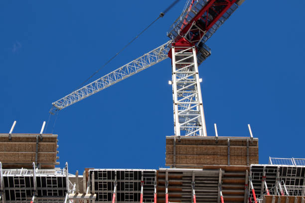 istock A construction crane is seen on a clear sky day. 1683922860